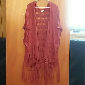 Rust colored crocheted vest by Kori.